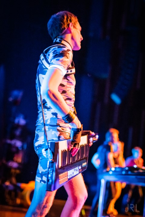 Dalziel performing a keytar on stage. Photo by JRL.